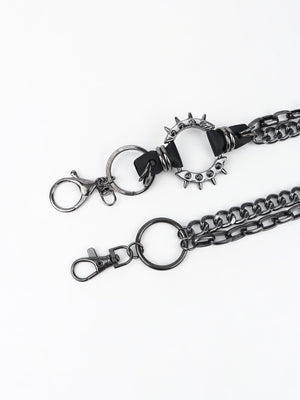 Black spiked chain harness belt with leather accents and silver hardware.