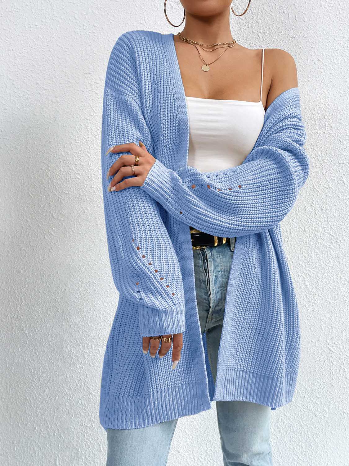 Longline knit open cardigan in Misty Blue with ribbed texture and openwork detail on sleeves.