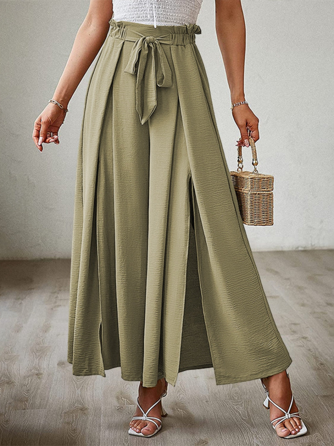 Matcha green paperbag waist palazzo pants with tie belt and high side slits.