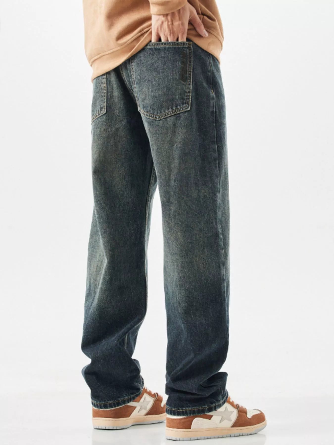 Relaxed fit vintage wide-leg jeans in blue denim with a distressed wash.