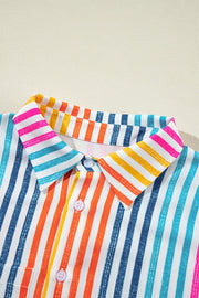Rainbow stripe relaxed fit button-down shirt with a collared neckline and white buttons.