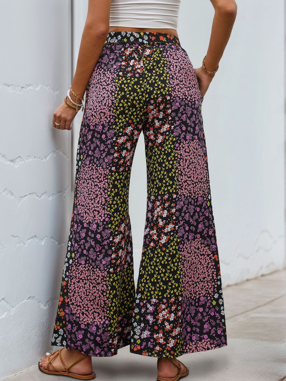 Floral panel palazzo trousers in black with a vibrant floral print and wide leg.