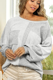 Colorblock sweatshirt in light gray with two front pockets and slouchy sleeves.
