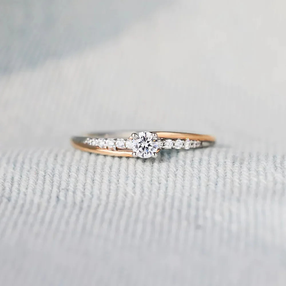 Dual band silver ring with diamond accents and a central solitaire stone.