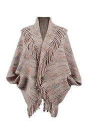 Textured knit cape in Khaki with fringe trim and colorful stripes.