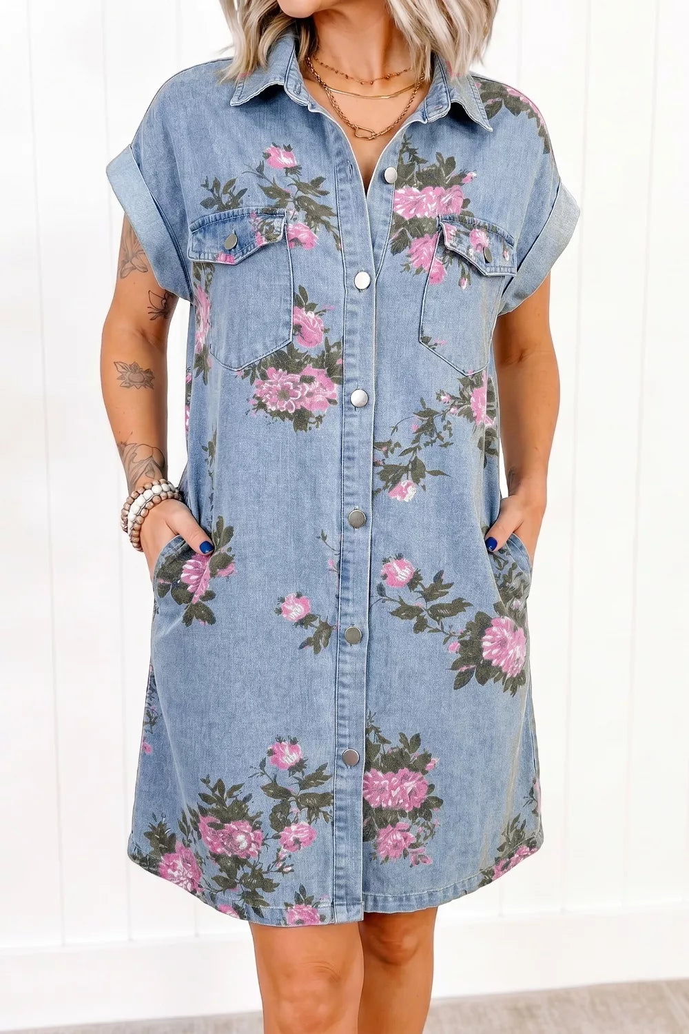 Denim shirt dress with pink floral print, short sleeves, and button front.