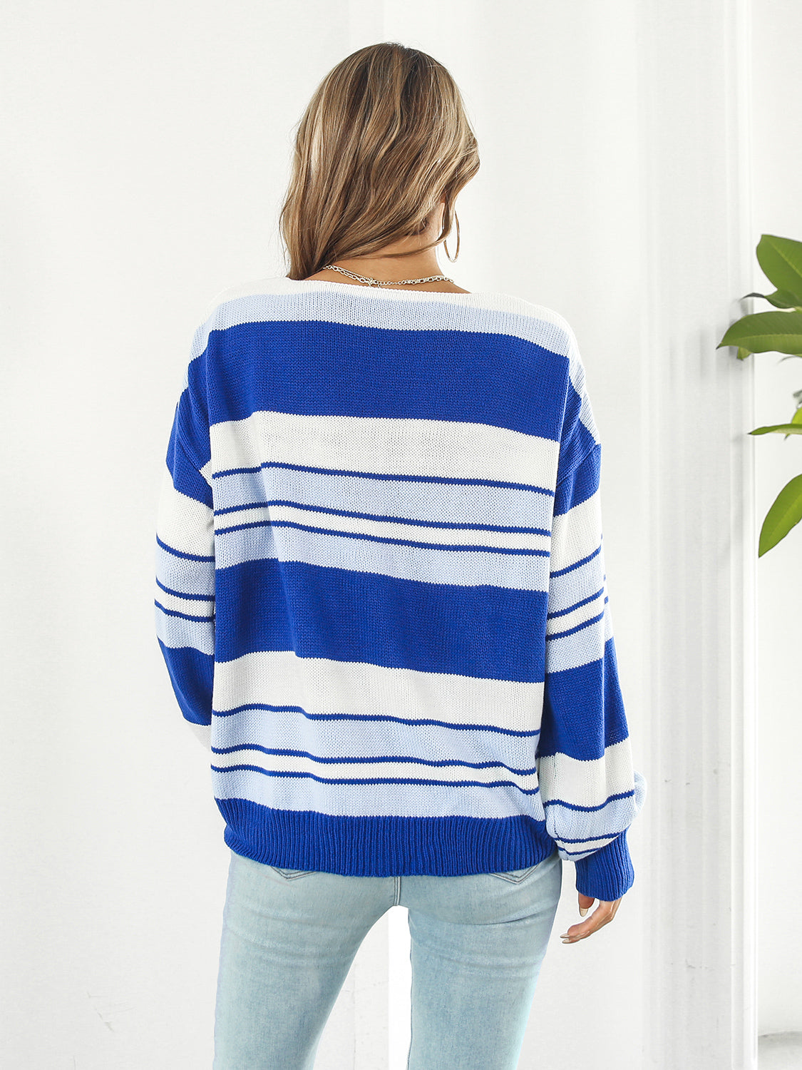Wide Stripe V-Neck Knit Sweater in blue and white acrylic with a relaxed fit.
