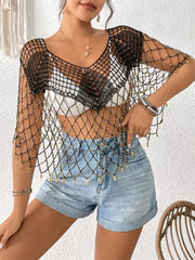 Black crochet cardigan with gold beads and fringe detail, V-neck, short sleeves.