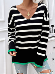 Oversized black and white stripe V-neck knit top with green trim