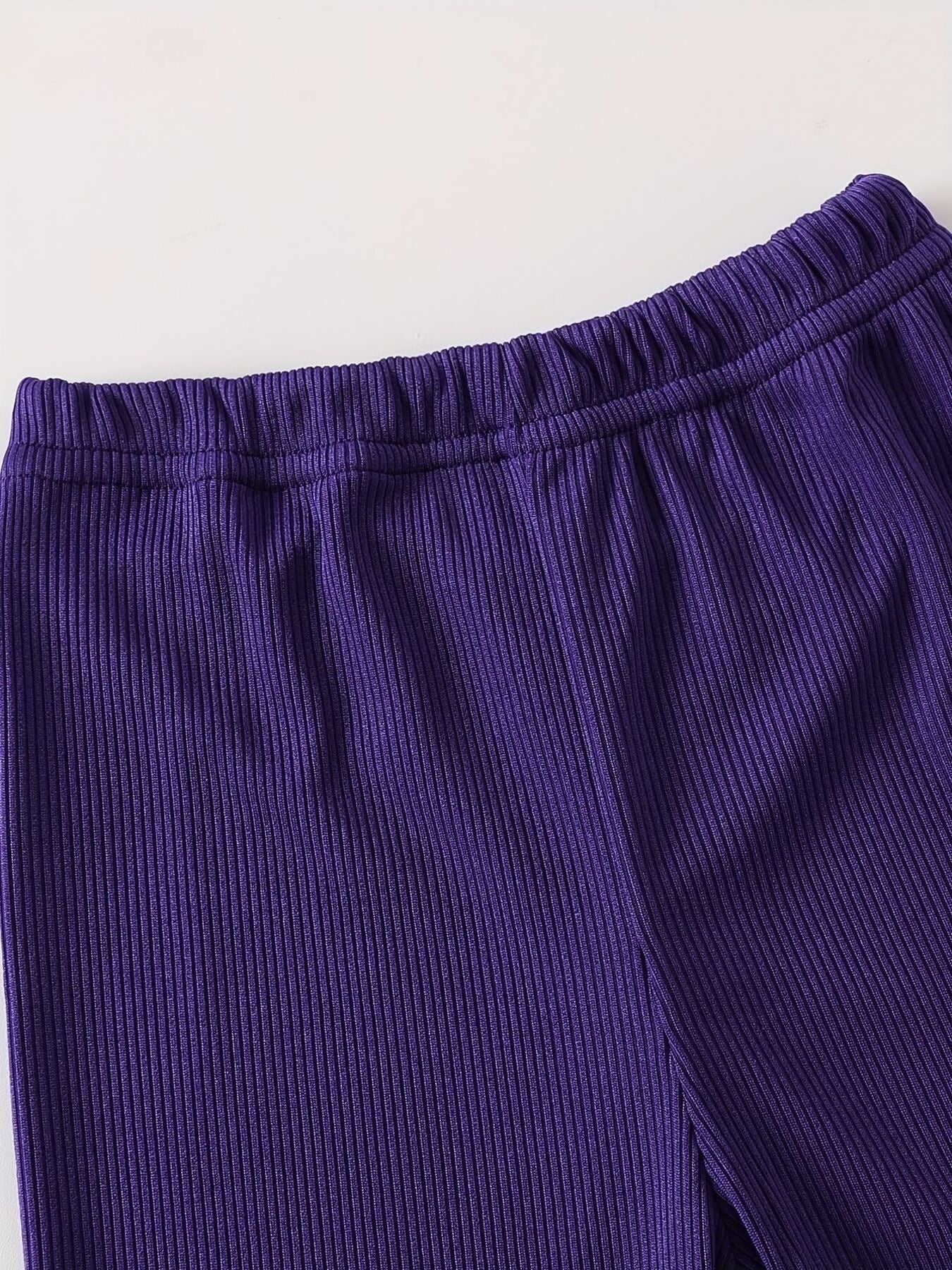 Purple ribbed baby pants with elastic waistband
