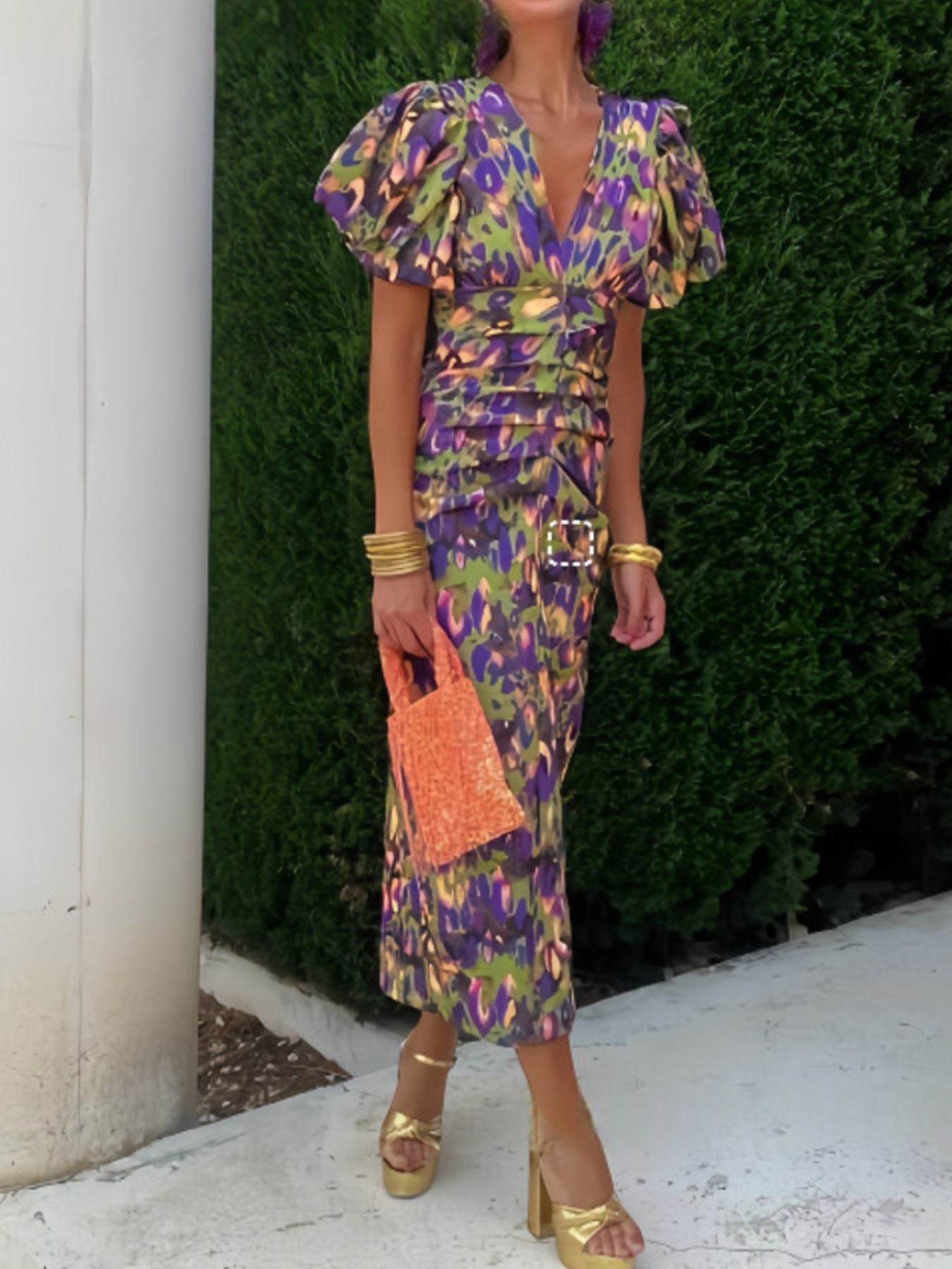 Vibrant abstract print midi dress with V-neck, puff sleeves, and ruched detail.