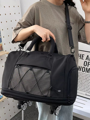 Black Oxford rolling travel bag with checkered front pocket and wheels