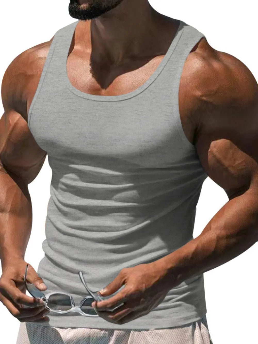 Gray scoop neck tank top with a ribbed texture, sleeveless, and a relaxed fit.