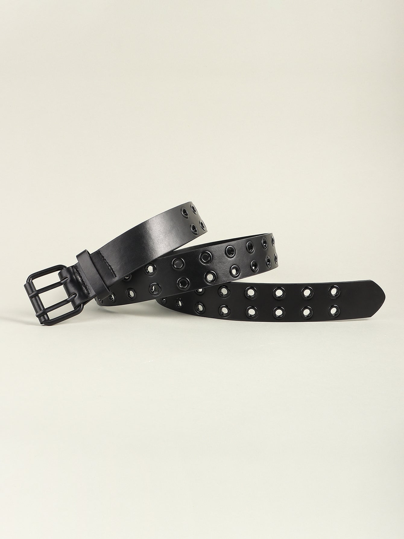 Black vegan leather belt with double grommet detailing and a matte black buckle.