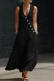 Black asymmetrical button-down midi dress with V-neck and sleeveless cut.