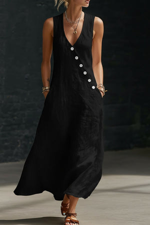 Black asymmetrical button-down midi dress with V-neck and sleeveless cut.