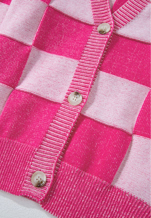 Hot pink checkerboard knit cardigan with button front and ribbed trim.