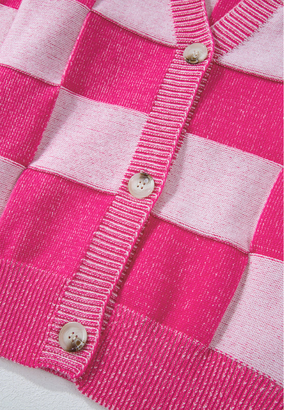 Hot pink checkerboard knit cardigan with button front and ribbed trim.