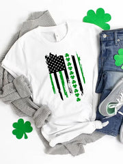 White t-shirt with distressed American flag graphic featuring shamrocks and green stripes.