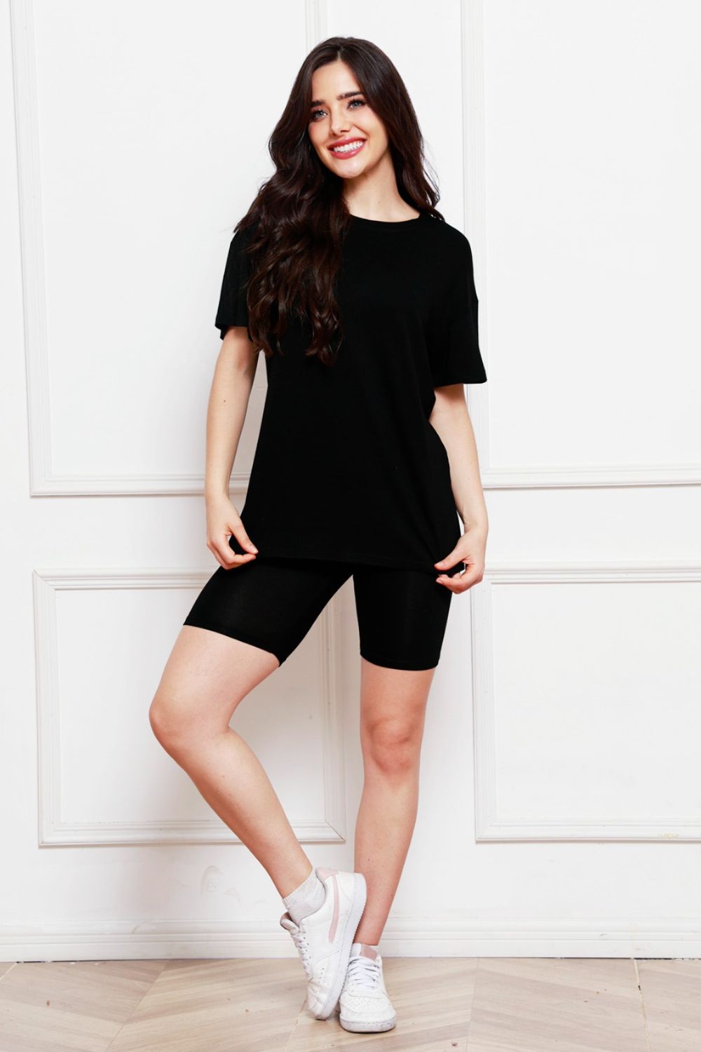 Black relaxed tee and biker short co-ord set with crew neck and short sleeves.