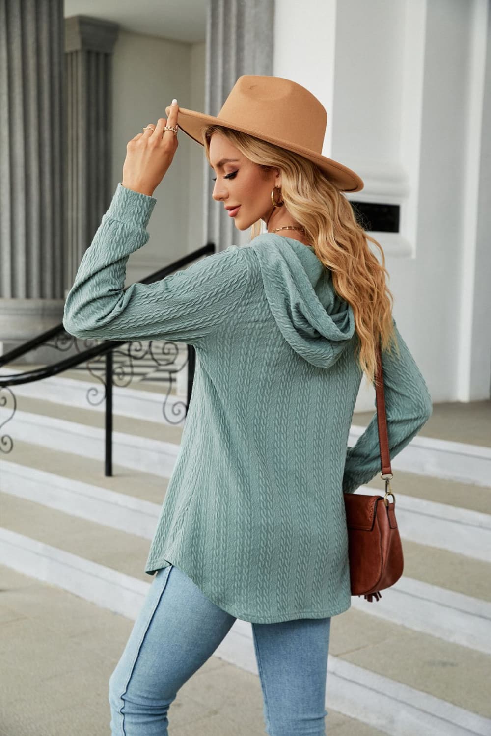 Sage textured henley hooded tunic with long sleeves and a relaxed fit.