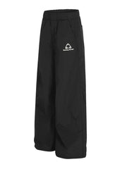 Black wide-leg sweatpants with crinkled texture and logo detail.
