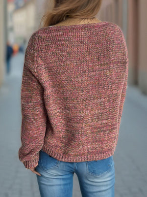 Textured slouch v-neck sweater in dusty pink with a marled knit pattern.