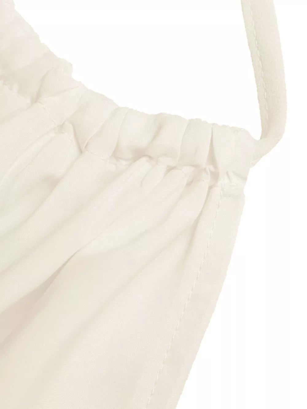 Gathered neckline cami top in off-white with a defined waist and peplum detail.