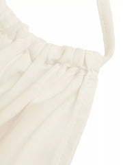 Gathered neckline cami top in off-white with a defined waist and peplum detail.