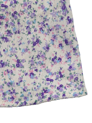 Floral lace-up cami maxi dress with a textured knit and purple floral print.