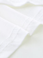 White cotton toddler t-shirt detail showing stitched seams