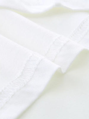 White cotton toddler t-shirt detail showing stitched seams