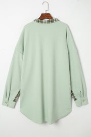 Light green waffle knit overshirt with plaid collar and cuffs, button front.