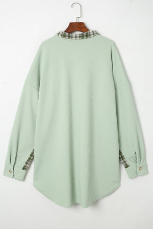 Light green waffle knit overshirt with plaid collar and cuffs, button front.