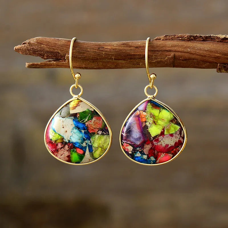 Teardrop dangle earrings with colorful mosaic stones and gold frames.