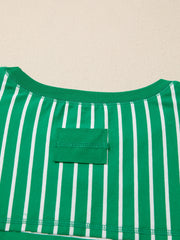 Green and white striped cotton t-shirt with crew neck and chest pocket detail.
