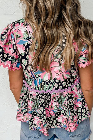 Scalloped sleeve peplum blouse in multicolor floral and leopard print with pink trim.