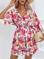 Floral ruffle hem mini dress with a deep V-neck and short sleeves.