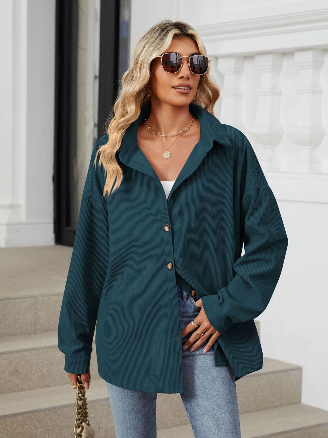Oversized corduroy shirt jacket in dark navy with button front and collar.