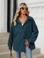Oversized corduroy shirt jacket in dark navy with button front and collar.