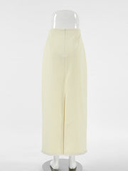Chic cotton midi skirt in beige with a front slit and frayed hem.