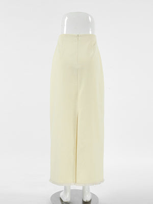 Chic cotton midi skirt in beige with a front slit and frayed hem.