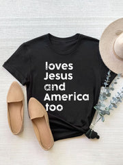 Black crew neck t-shirt with white text graphic that says "loves Jesus and America too