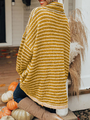 Gold striped oversized turtleneck sweater with slouch pockets, shown from the back.