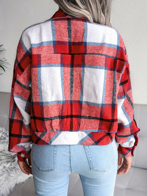 Boxy red plaid shacket with gathered hem and buttoned cuffs.
