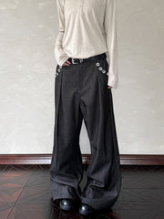 Men's black wide leg sweatpants with decorative buttons and a belt.