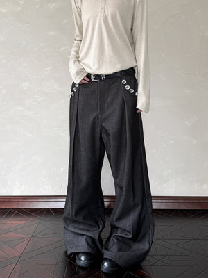 Men's black wide leg sweatpants with decorative buttons and a belt.