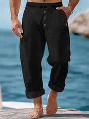 Black relaxed fit drawstring sweatpants with button fly and cuffed hem