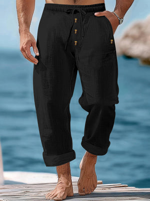 Black relaxed fit drawstring sweatpants with button fly and cuffed hem