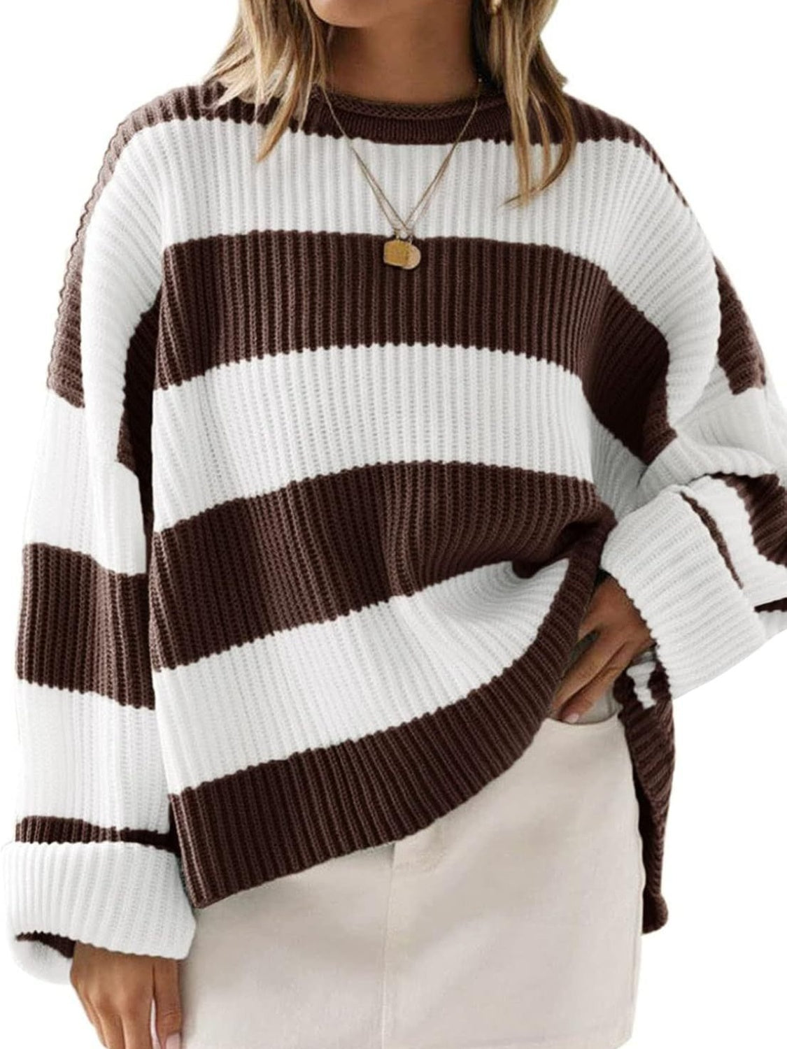 Striped oversized knit sweater in chocolate and white with a crew neck and cuffed sleeves.
